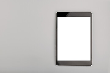 blank tablet computer on grey background