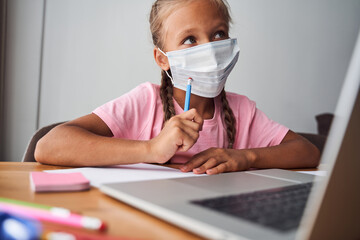 Girl puzzled about homework
