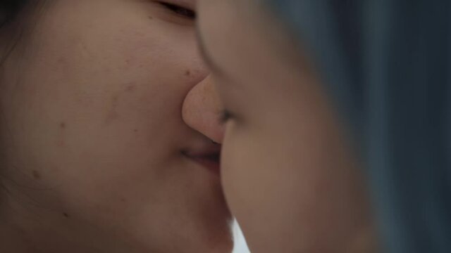 Close up video of lesbian couple kissing intimately. Shot with RED helium camera in 8K