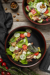 salad with fresh vegetables on a wooden restaurant table