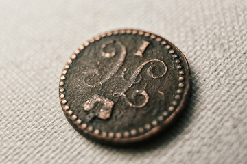 A rare coin from the times of Nicholas 1 in tsarist Russia. The coin close-up. Macro photo of an ancient copper coin.