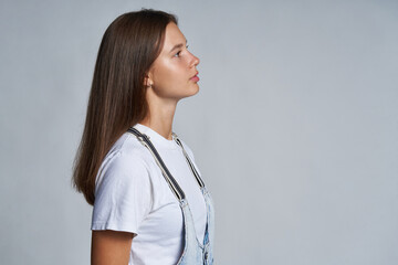 Closeup profile portrait of a teen gir looking forward
