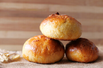 close up of stack of baked bread on table 