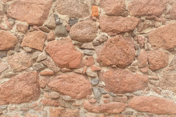 the granite stones are cemented in the form of a wall. Granite texture