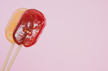 Closeup shot of lollipops on an isolated pink background