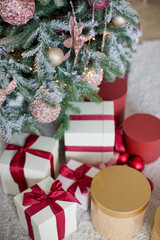 Gift boxes near Christmas tree
