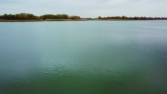 autumn landscape on the river. calm river surface, windless weather.