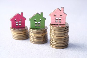  the concept of finance concept with stack of coins and house on table 