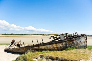 Fototapeta na wymiar Wrecked boat on the beach, Portbail / Port-bail, Manche, Normandy France