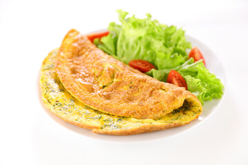 plate of omelet and salad isolated on white background
