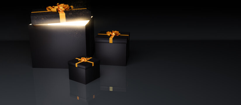 Schwarze Geschenkboxen mit goldener Schleife