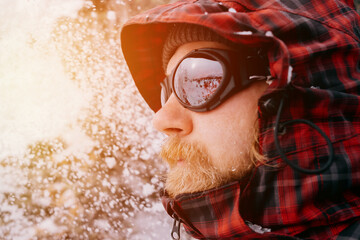 Portrait of a male traveler in the winter forest