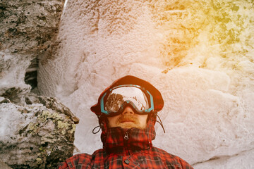 Portrait of a male traveler in the winter forest