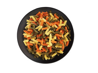 Colorful pastas. Yellow red and green pasta. White background and pasta. Carbohydrates and pasta.