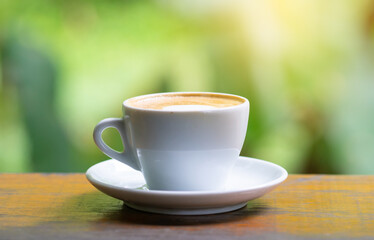 coffee cup and cake on wood table.