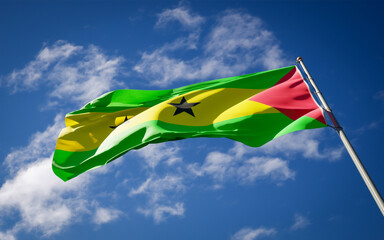 National state flag of Sao Tome fluttering at sky background.
