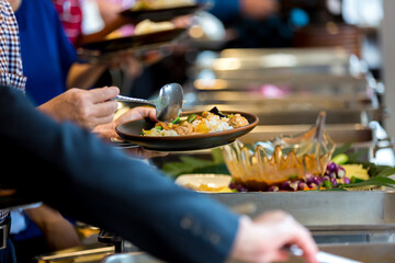 Food Buffet Catering Dining Eating Party Sharing Concept. People group catering buffet food indoor in luxury restaurant with meat colorful fruits and vegetables
