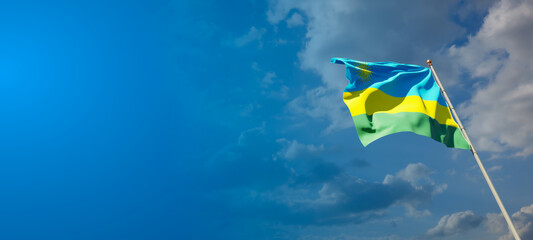Beautiful national state flag of Rwanda with blank space.