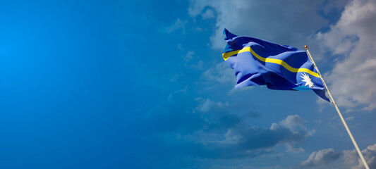 Beautiful national state flag of Nauru with blank space.