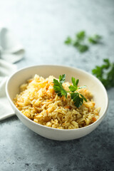 Homemade spicy rice with carrot and parsley