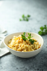 Homemade spicy rice with carrot and parsley