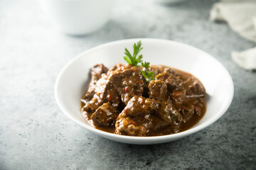 Traditional homemade beef ragout with fresh parsley