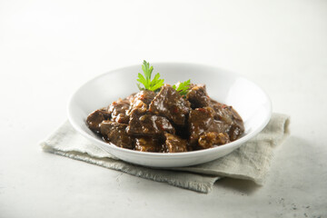 Traditional homemade beef ragout with fresh parsley