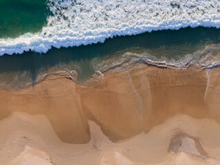 (Top view) Beach seawater wave on sandy beach. Background and travel concept.