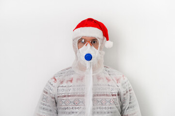 Portrait of adult person wearing protection costume, face mask, glasses, Santa hat on white background. Christmas coronavirus concept