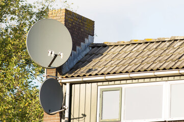 Satellite dish on a facade of a house in the Netherlands