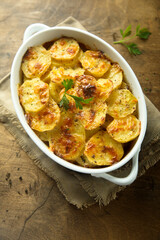 Traditional homemade potato gratin with cheese