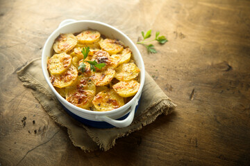 Traditional homemade potato gratin with cheese