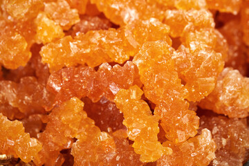 Crystalline sugar on a stick, close-up, macro