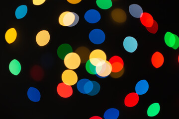 Background of colored bokeh. Multi-colored bright blurred texture of lights
