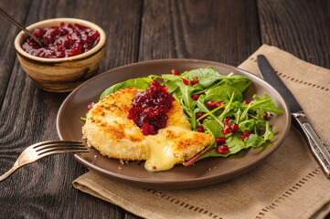 Fried camembert cheese and cranberry sauce.