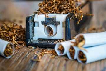 hand-made cigarettes at home using a manual machine