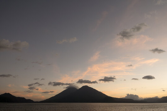 Guatemala, Central America: sunset at lake Atitlán (Atitlan) with volcanos Atitlan and 
Toliman