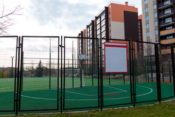 Fototapeta na wymiar sports playground in the courtyard of multi-storey residential buildings