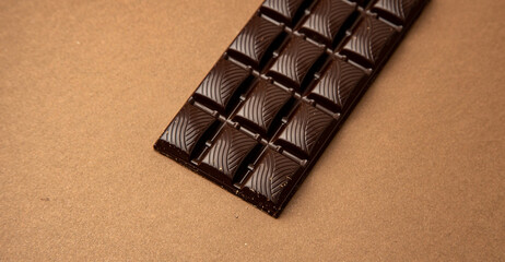 chocolate bar on brown background