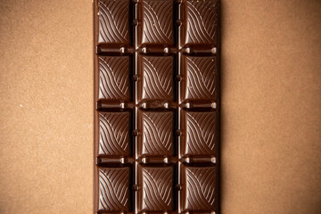 chocolate bar on brown background