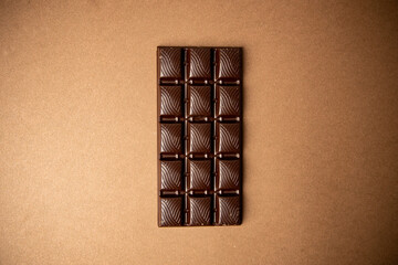 chocolate bar on brown background