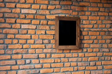 Fototapeta na wymiar front view empty frame on brick wall