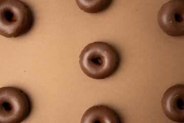chocolate bagel on brown background