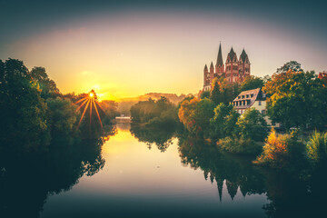 

Nice landscape shot from Limburg. on the Lahn, with the river and many trees and bushes. Sunrise...