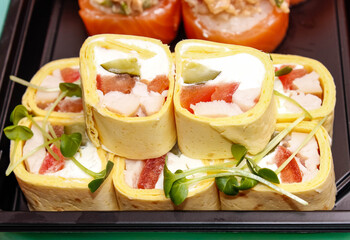 Several Sushi roll close-UPS that are wrapped in pancakes.