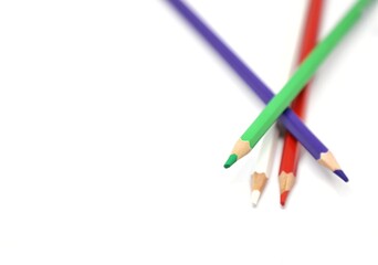 Colorful wooden color pencils isolated on white background-red, white, violet, red color pencils with text space at the left