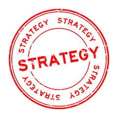 Grunge red strategy word round rubber seal stamp on white background