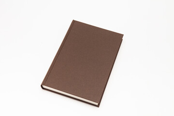 Brown color book on white background