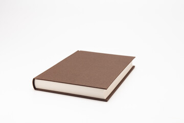 Brown color book on white background