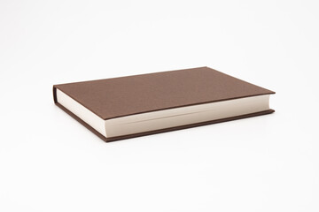 Brown color book on white background